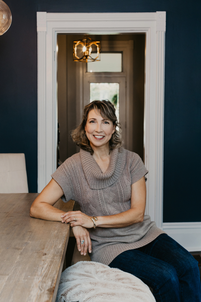 Wendy Ronberg sitting on a dinning chair